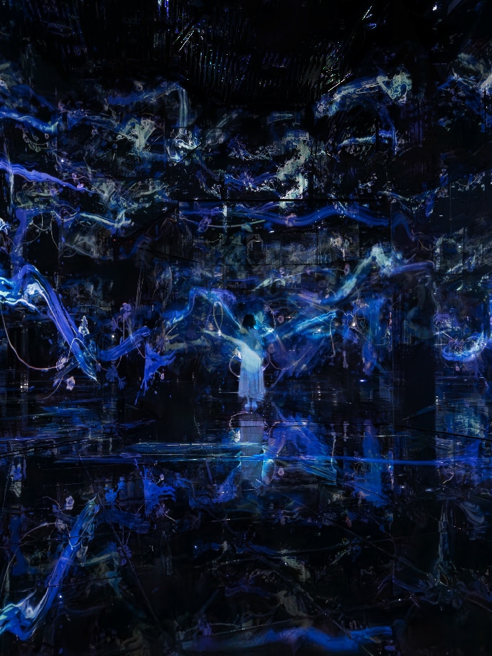A lady mesmerized whilst looking at the Continuous trajectories in flux and form artwork